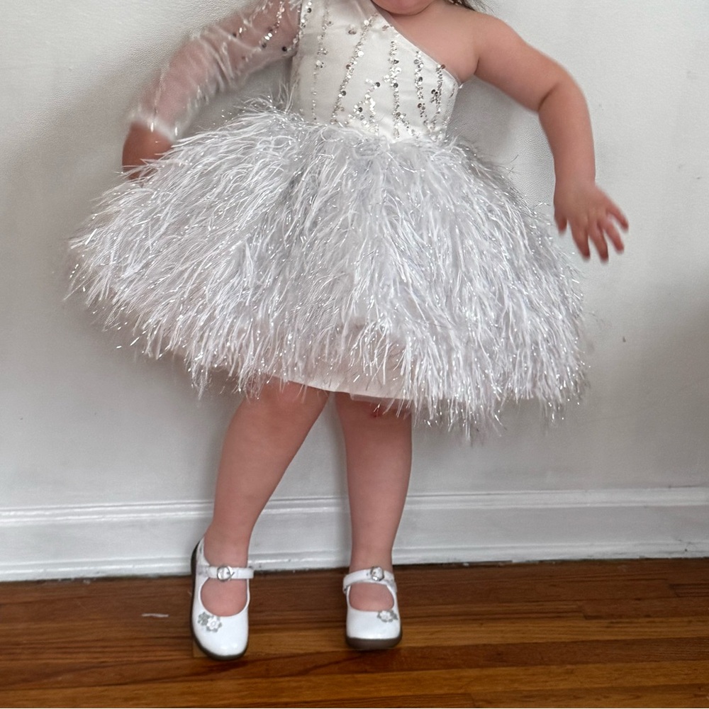 White Formal Dress with Feathered Skirt and Beaded Bodice